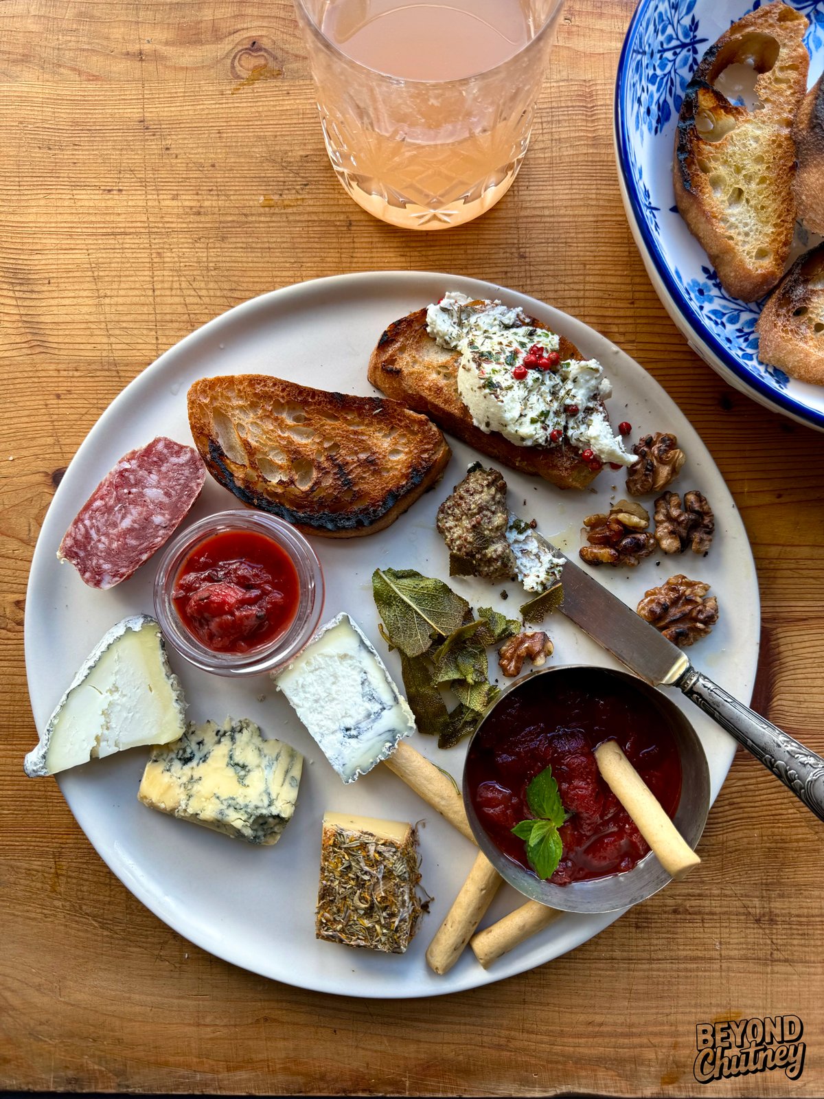 This strawberry ginger chutney is one of my favorite things to add to a cheese plate. It goes so well with sausage, toasted bread and a handful of olive oil roasted walnuts and crispy sage. I like it best with a glass of sparkling rhubarb juice or a light rosé.