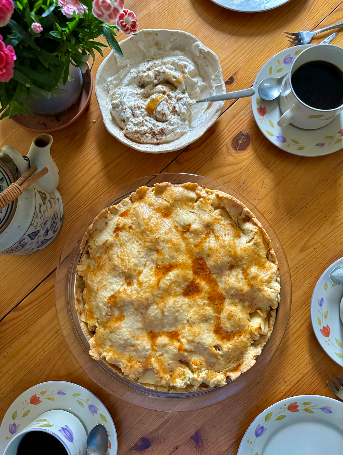 Traditionally, this kind of apple cake is served with a spoonful of whipped cream - simple and classic. I gave it a little twist with a spiced crème fraîche and yogurt topping, inspired by masala flavors. The subtle warmth of cardamom, cinnamon and a hint of ginger and honey pairs beautifully with the tart apples and buttery crust. It adds just enough depth to make something familiar feel a little new.