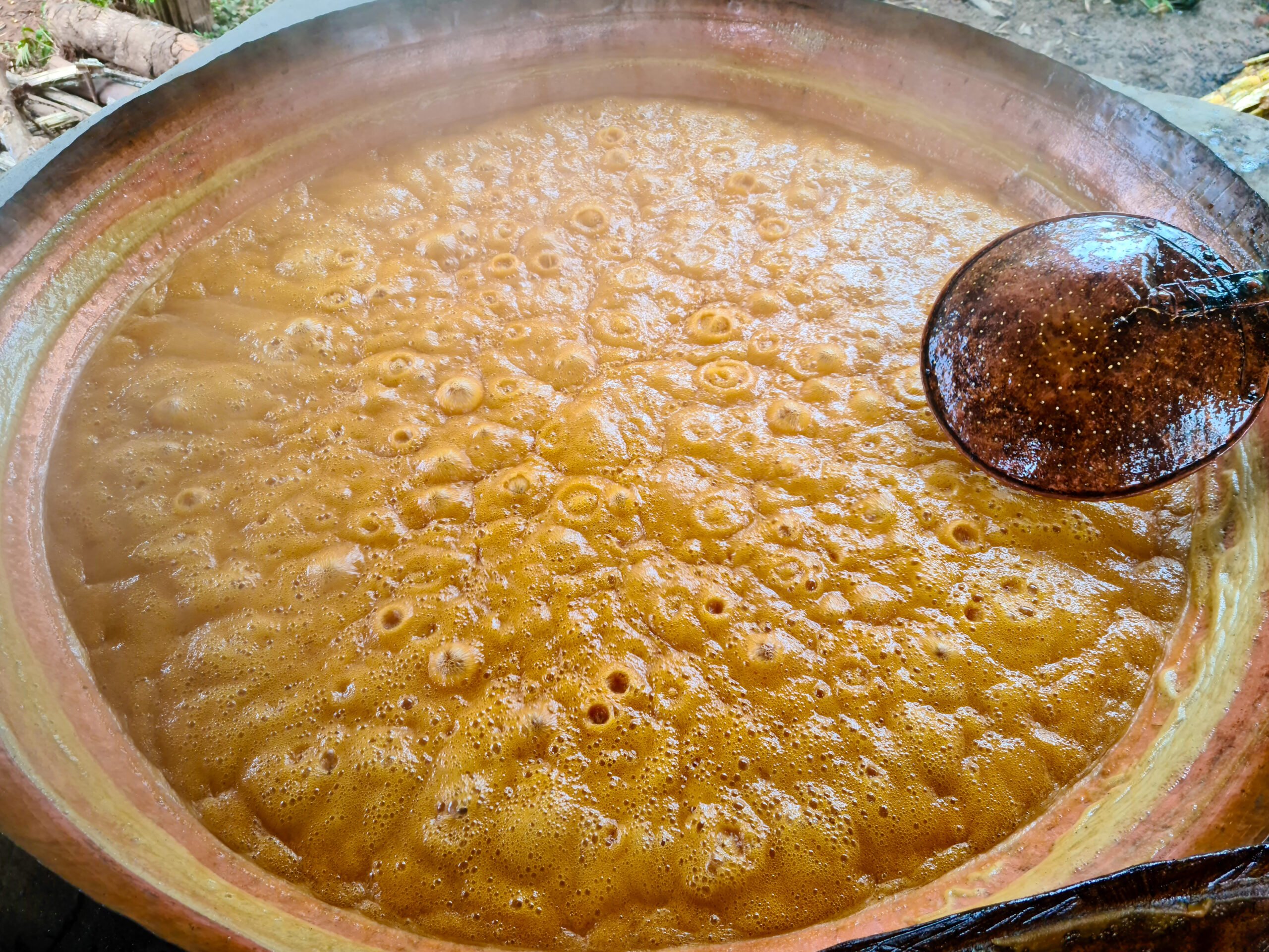 Thick sugarcane syrup bubbling over open flames - this is how jaggery comes to life.