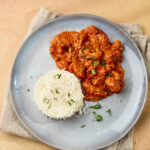 Butter Chicken (Murgh Makhani) served in a plate with rice
