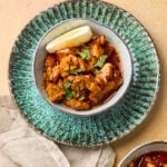 Garlic butter chicken served in a bowl with golden seared chicken pieces coated in rich garlic butter sauce, garnished with herbs