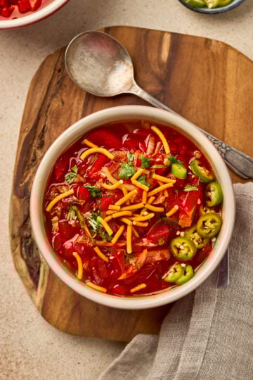 Manchow Soup served in a bowl, topped with crispy fried noodles and garnished with spring onions.
