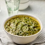 Punjabi Saag served in a bowl, garnished with ginger juliennes.