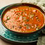 Tikka Masala Sauce in a bowl with creamy tomato base, garnished with cilantro.