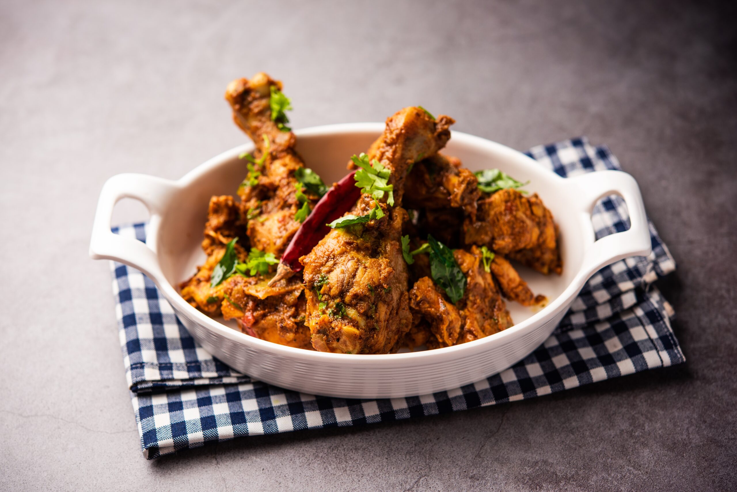 Chicken Sukka; a traditional Kolhapuri-style dry chicken curry made with Kolhapuri masala, roasted coconut, and aromatic spices.