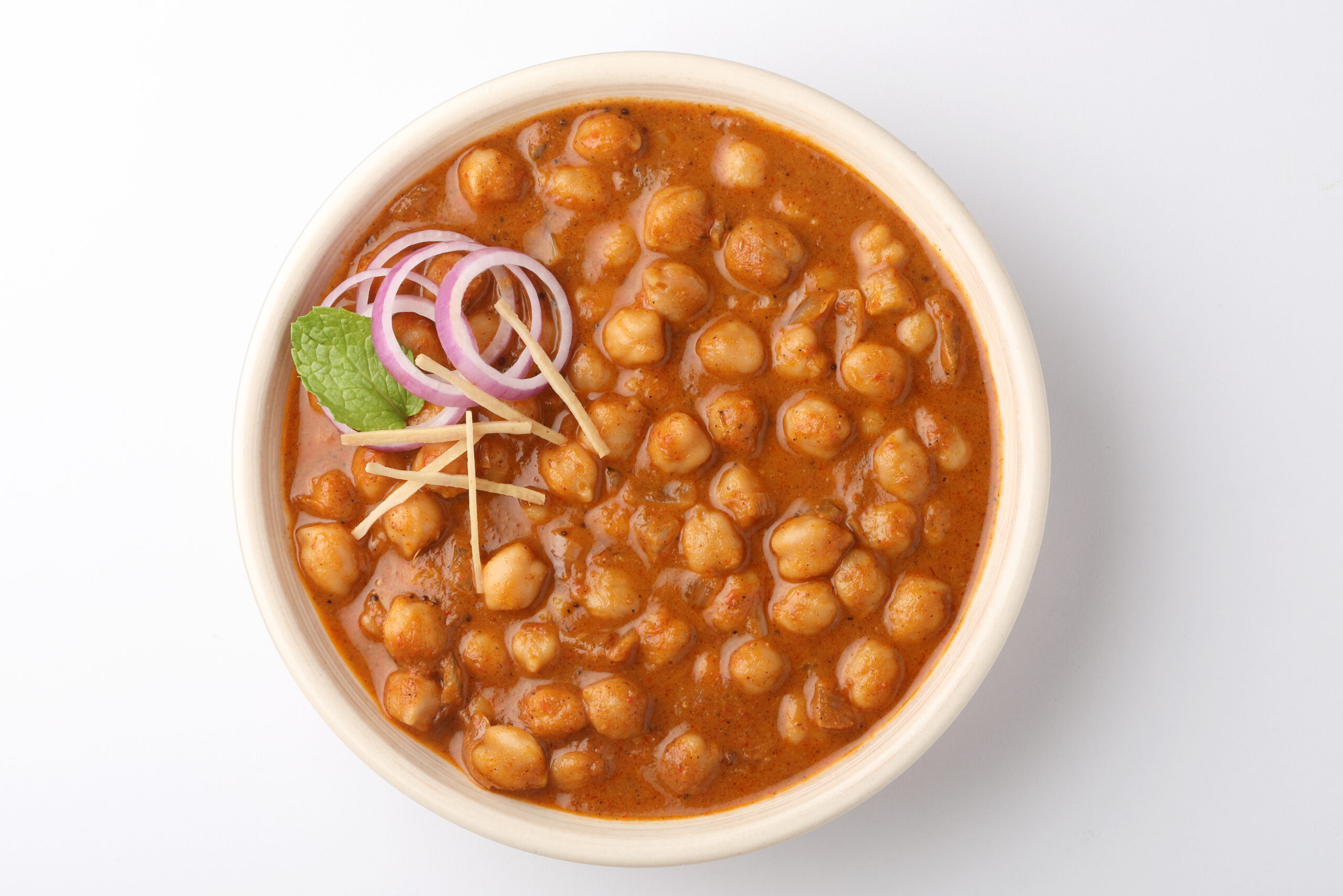 Chole (chickpea curry), hearty North Indian dish made with tender chickpeas simmered in a spiced tomato-onion gravy.