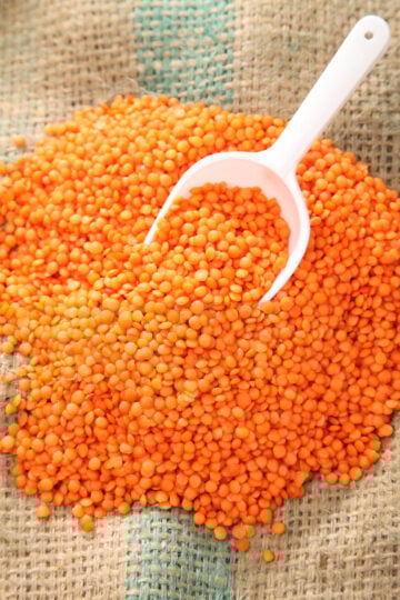 Masoor dal (red lentils), orange-red Indian lentils rich in protein and iron, commonly used in dals, soups, and curries.