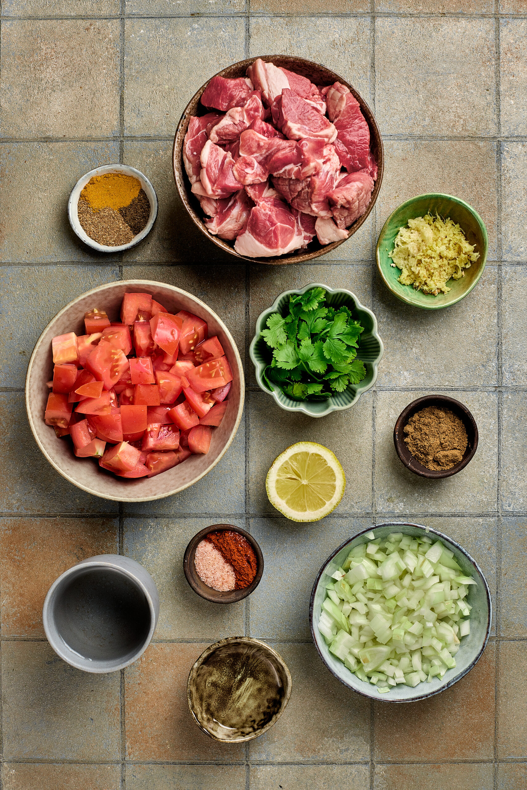 Close-up of Mutton Curry showing tender meat pieces in thick, aromatic gravy.