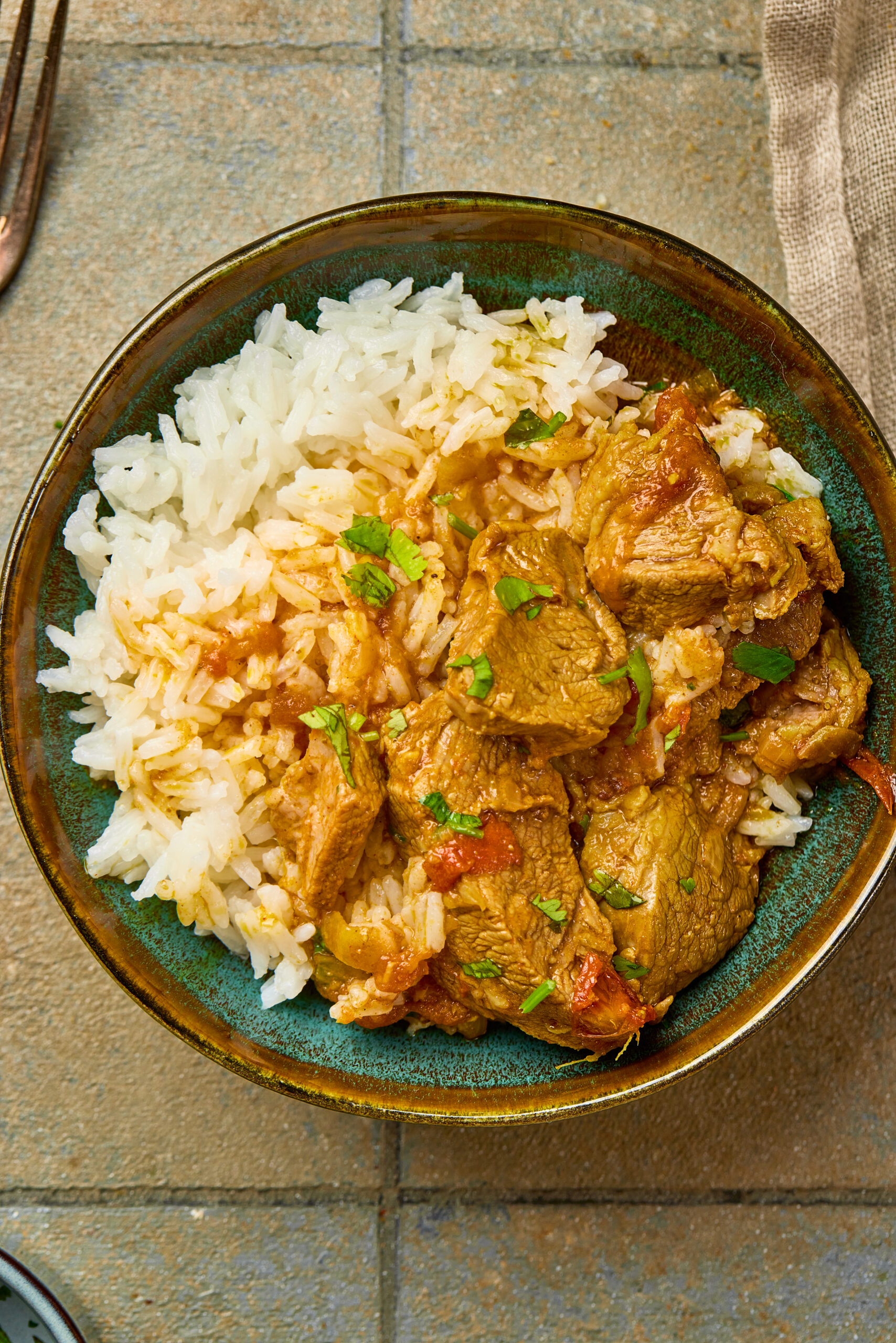 Mutton curry serving with rice in a plate
