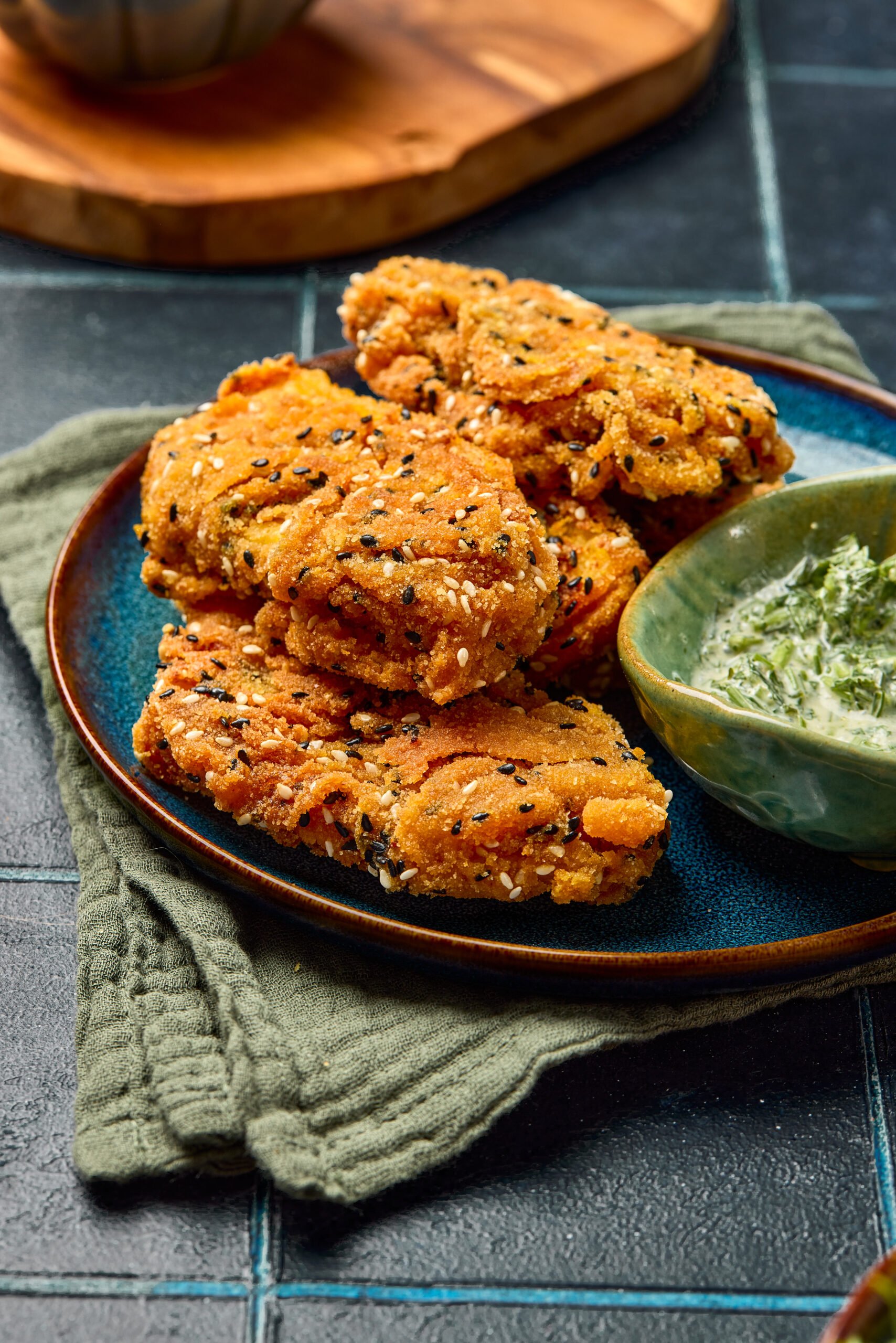 Sesame-Crusted Paneer Fingers served with mint chutney.