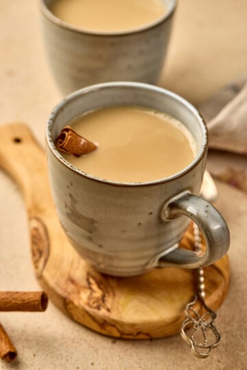 Wagh Bakri Masala Tea Copycat served in a cup with steam rising, showing creamy spiced chai and rich color.