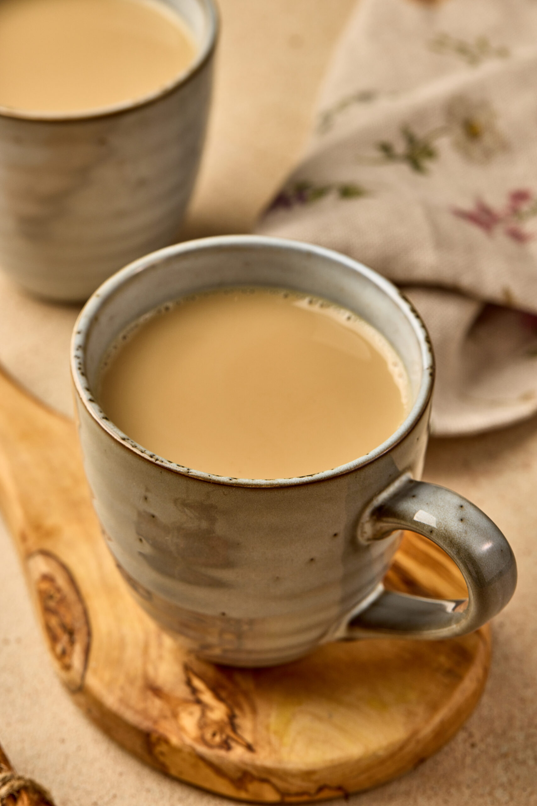 Close-up of Wagh Bakri Masala Tea Copycat showing rich brown color and frothy surface of freshly brewed chai.