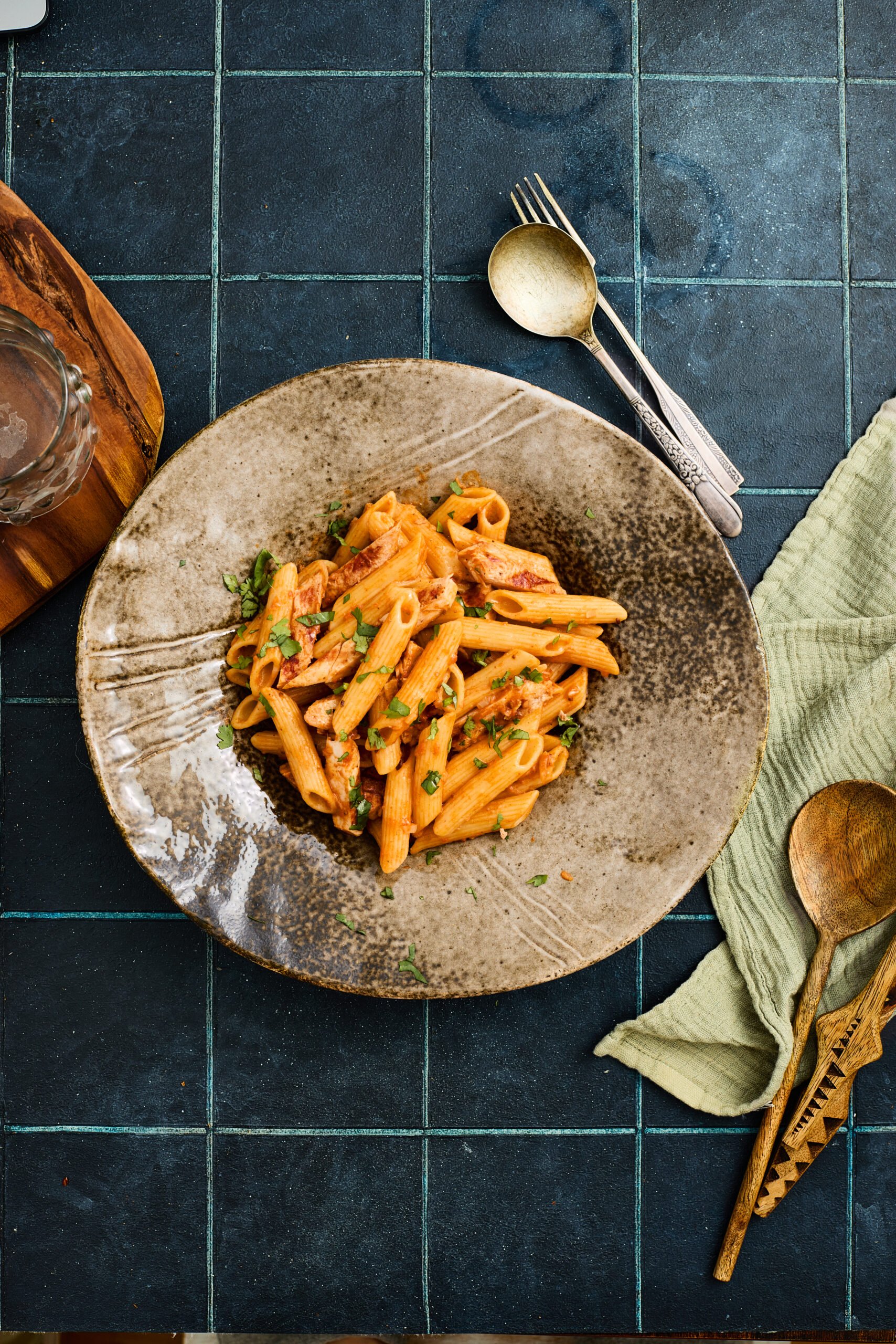 Plate of creamy butter chicken pasta ready to serve.