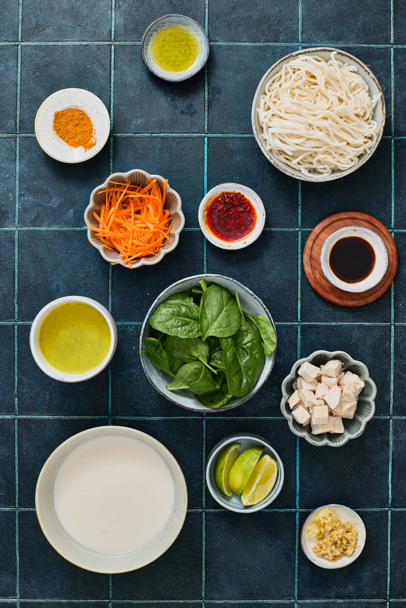 Ingredients for coconut curry ramen on a kitchen counter