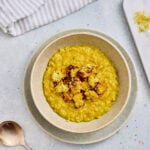 Curry risotto with roasted cauliflower served in a bowl