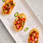 Masala Bruschetta topped with spiced tomatoes on crisp toasted bread.