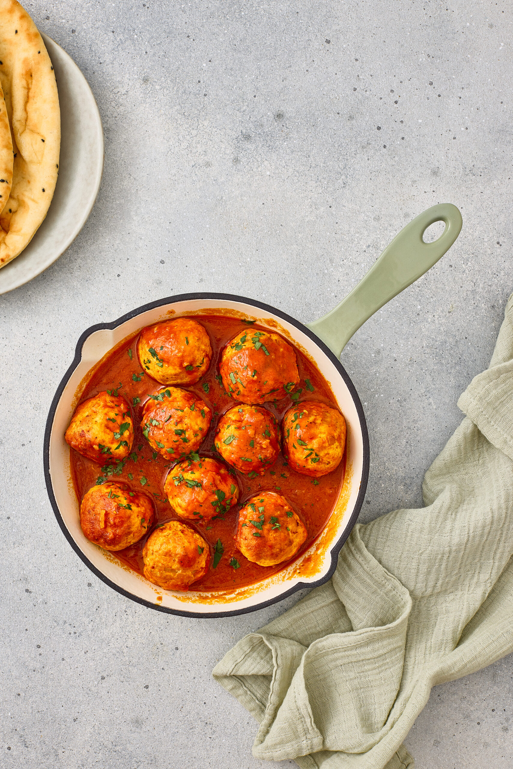Masala meatballs served in a thick tomato-based curry gravy.