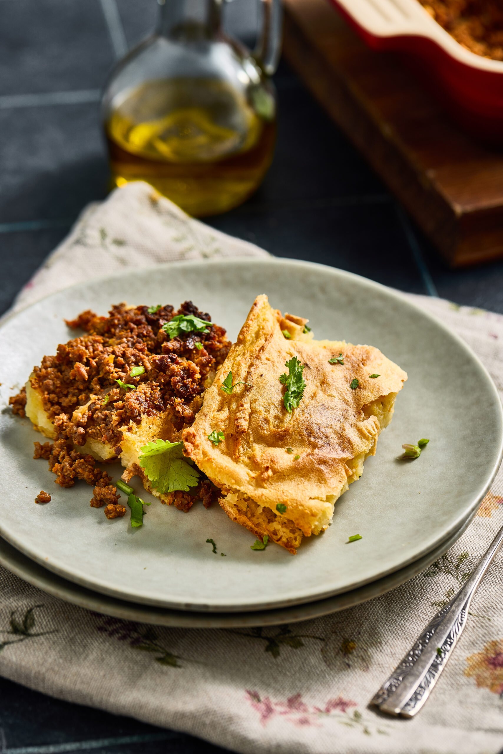 Close-up of Masala Shepherd’s Pie showing spiced mince and mashed potato layers.
