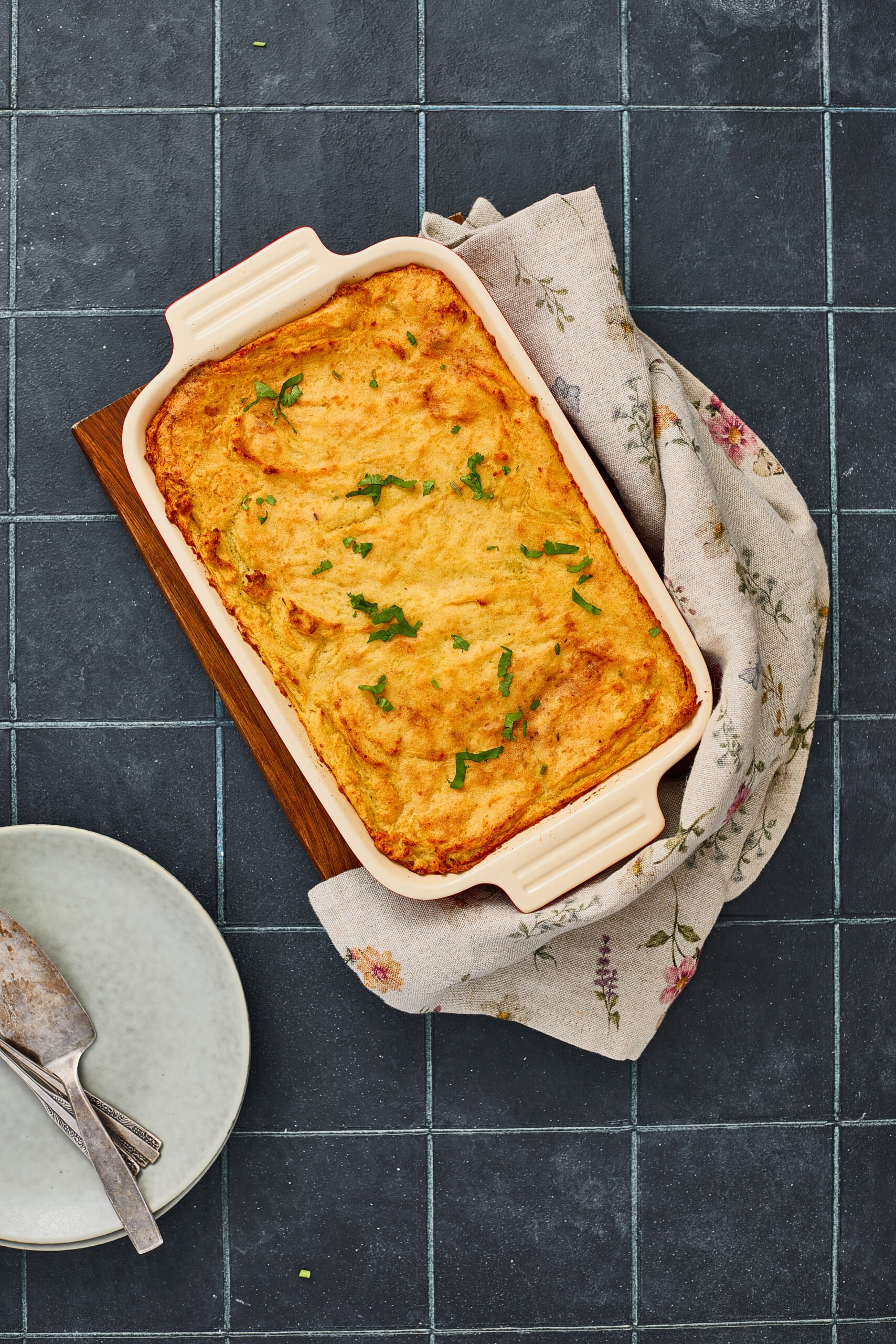 Masala Shepherd’s Pie topped with creamy mashed potatoes and baked mince base.