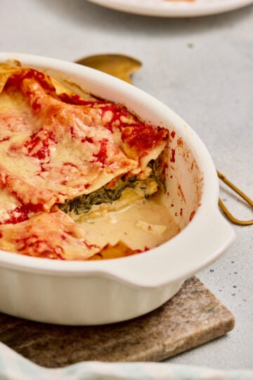 Close-up of creamy Palak paneer lasagna with soft paneer layer.