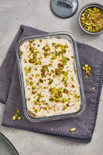 Pistachio rose tiramisu with creamy layers and chopped pistachios