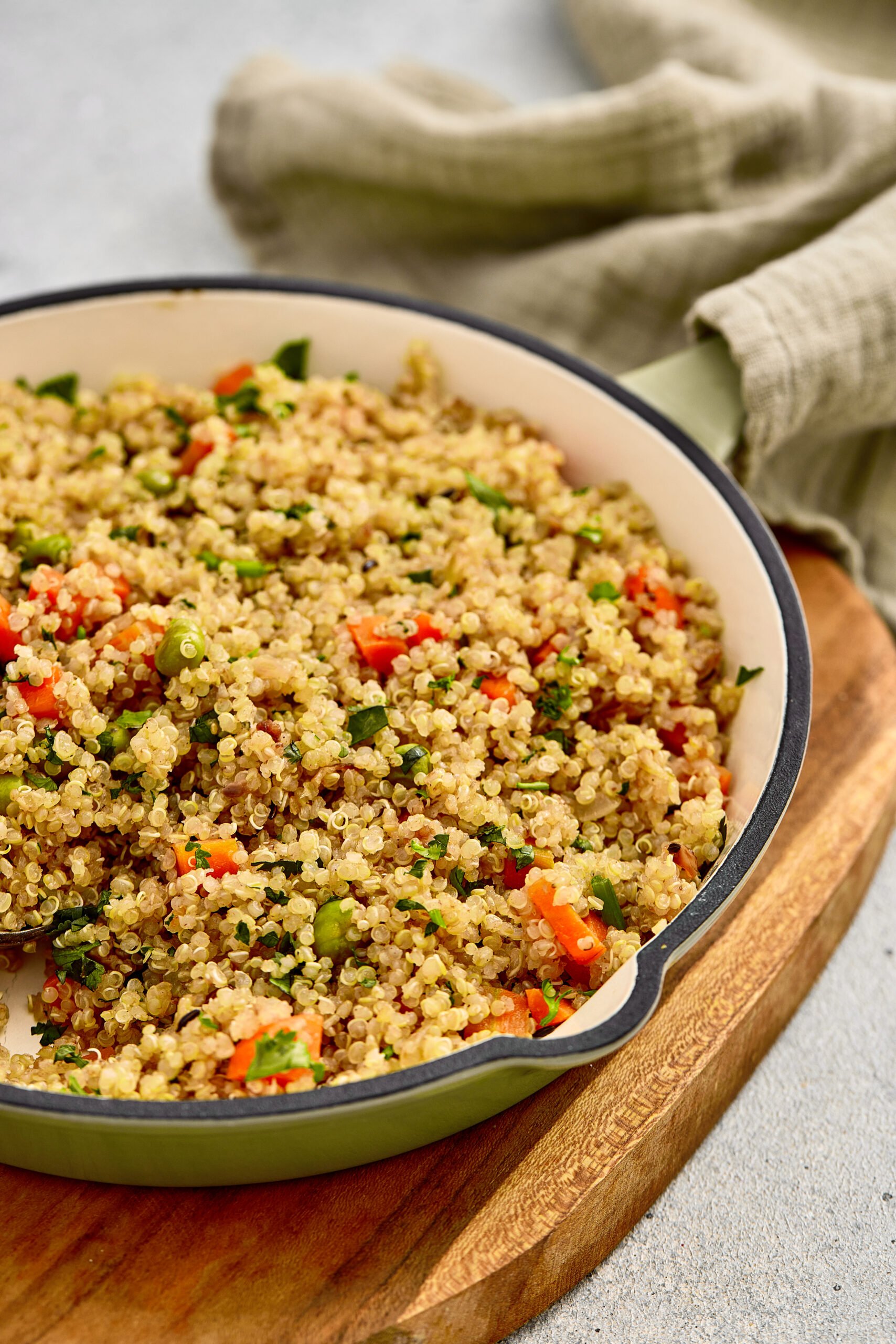 A bowl of light and aromatic Quinoa Pulao garnished with coriander leaves.