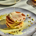 Rasmalai pancakes stacked with creamy topping