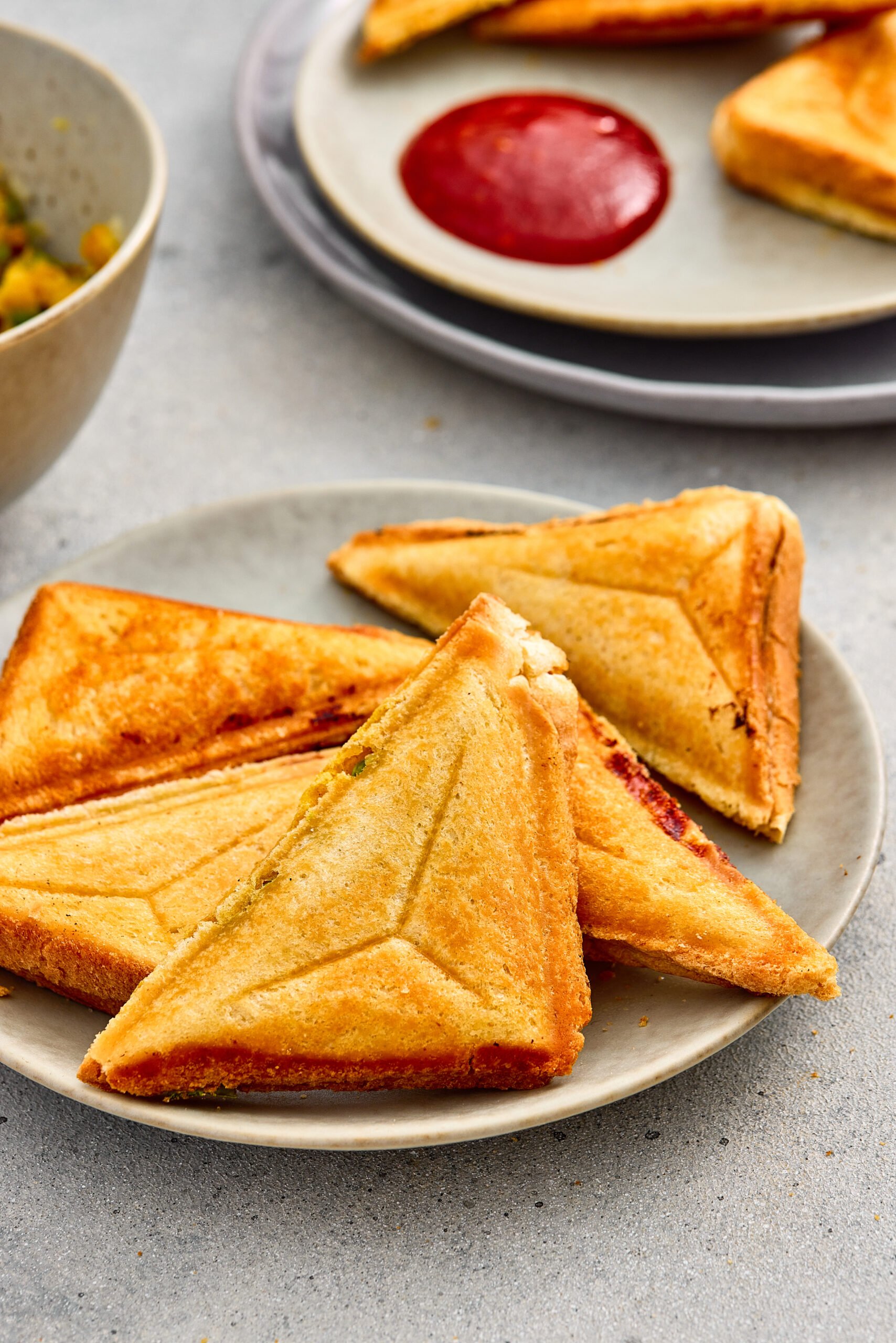 Close-up of Samosa Toasties with a crisp outer layer and soft filling inside.