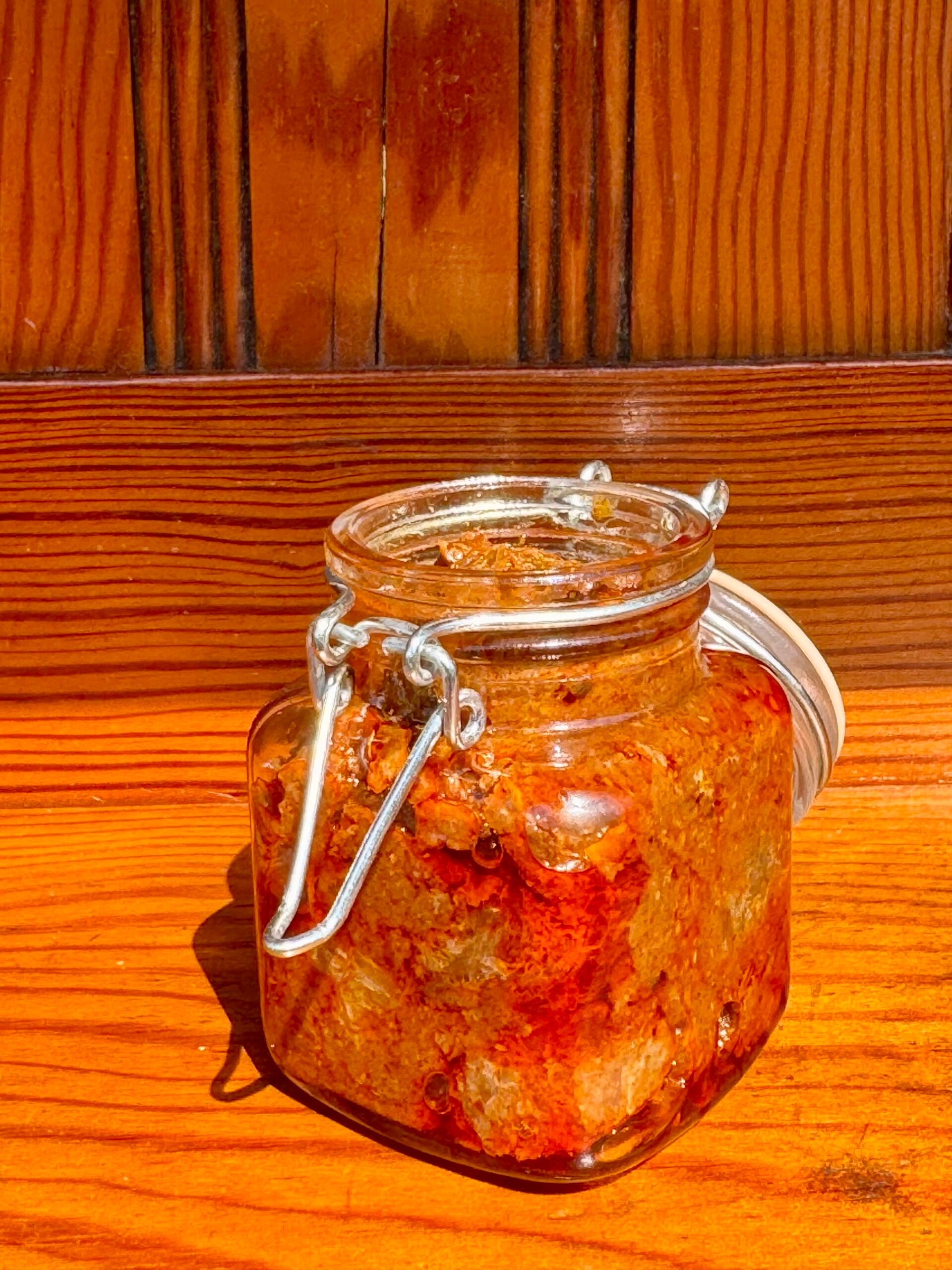 Usirikaya amla pickle in a glass jar