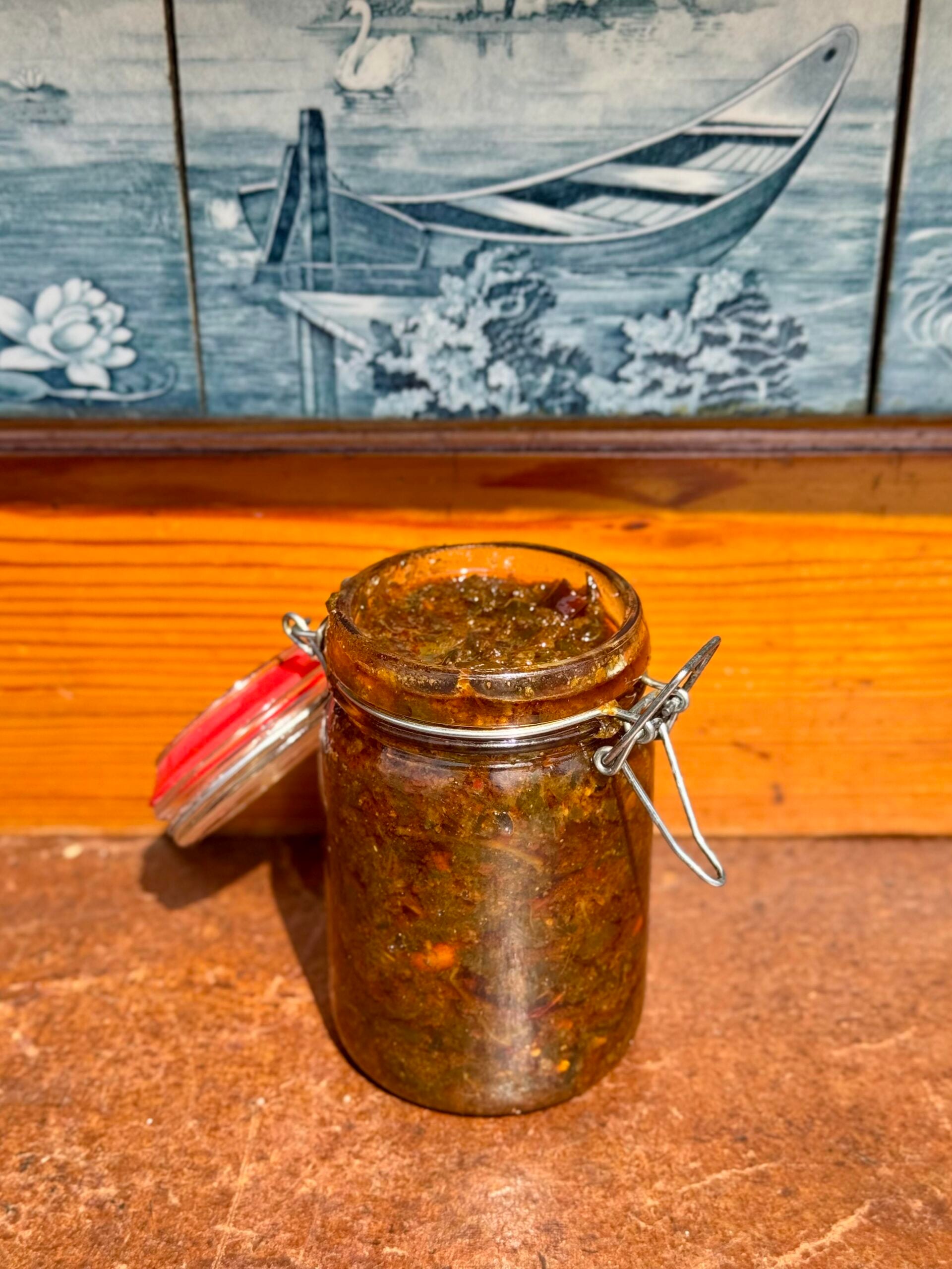 Gongura pickle store in glass jar.