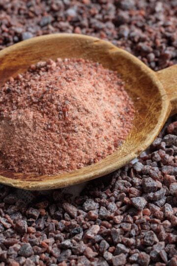 Kala namak (Black Salt) in a wooden spoon.