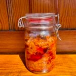 Mango thokku pickle store in glass jar.