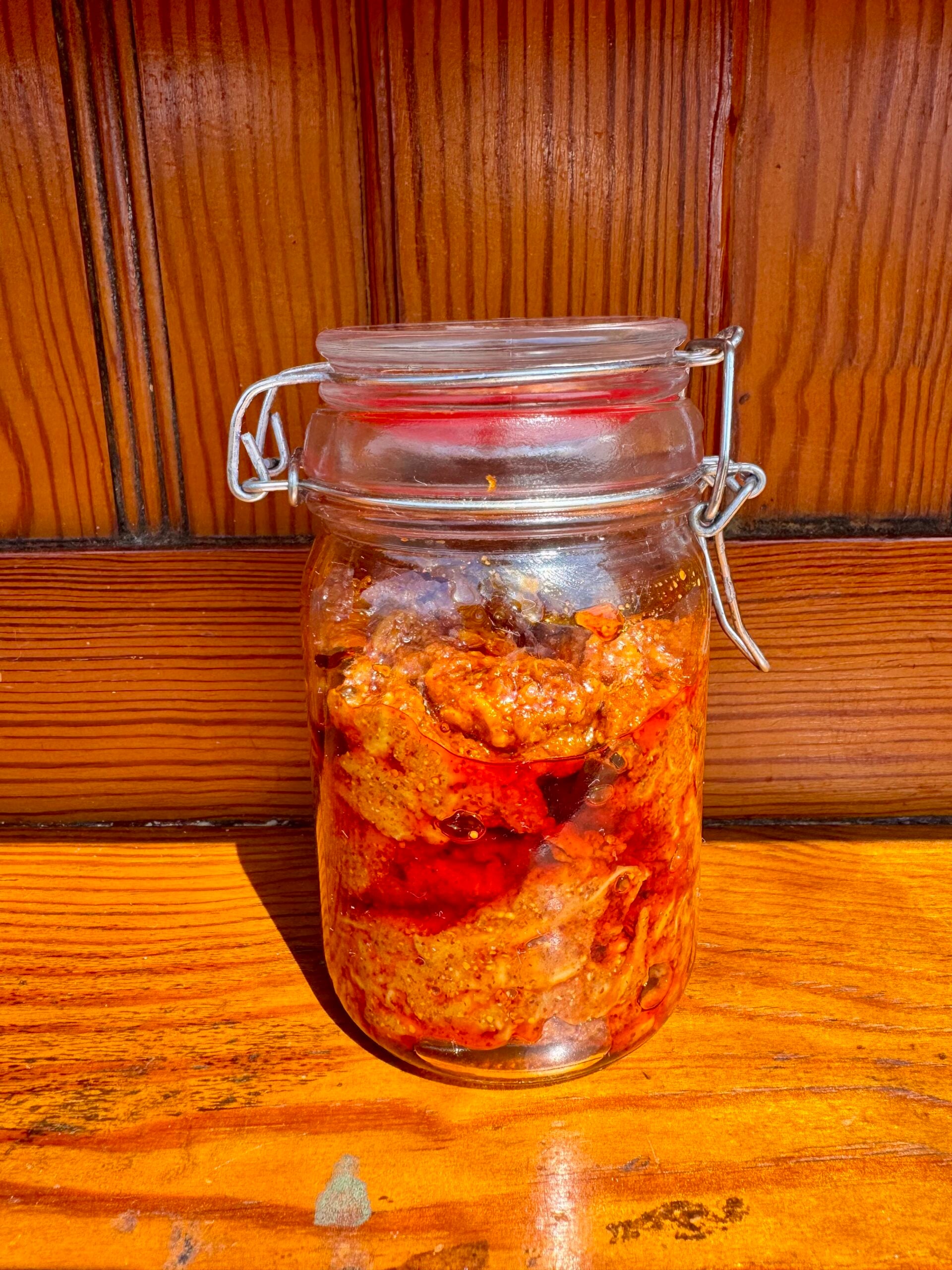 Mango thokku pickle store in glass jar.